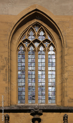 Pointed gothic window arch with tracery at St John church in the old town of Kitzingen  Franken region in Germany