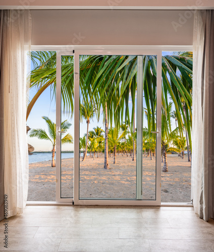 large glass door overlooking the beach