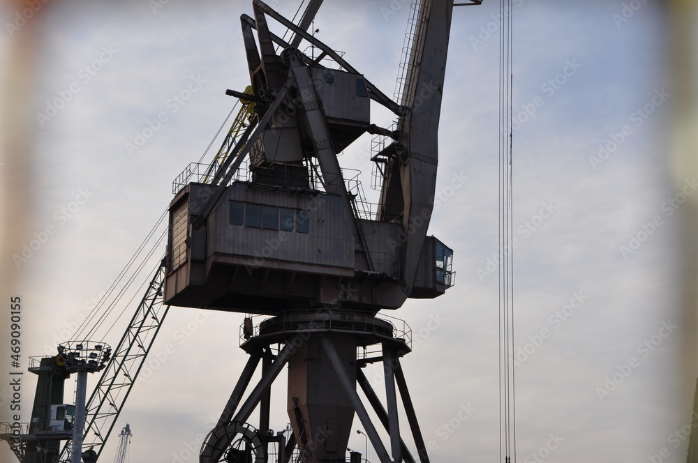 Old metallic crane details with sky as background in Rijeka harbour, Croatia Old metallic crane details with sky as background in Rijeka harbour, Croatia