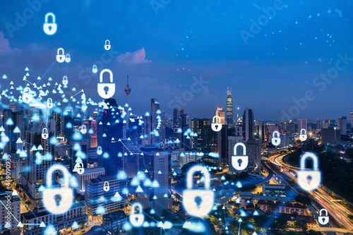 Photography Glowing padlock hologram, night panoramic city view of Kuala Lumpur, Malaysia, Asia