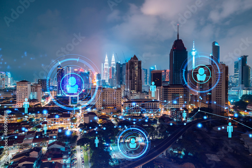Photography Glowing social media icons on night panoramic city view of Kuala Lumpur, Malaysia, Asia