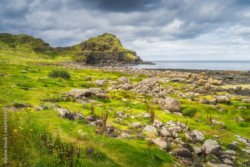 Rocky beach and coastline with cliffs and rock formations in Giants Causeway, Wild Atlantic Way and UNESCO world heritage, Northern Ireland