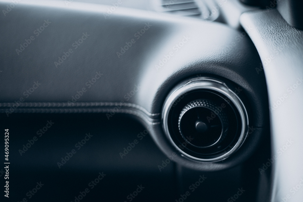 Details of a car standing in car showroom Details of a car standing in car showroom