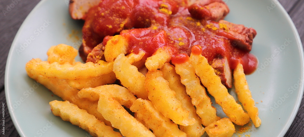 delicious sausage with french fries and curry sauce delicious sausage with french fries and curry sauce