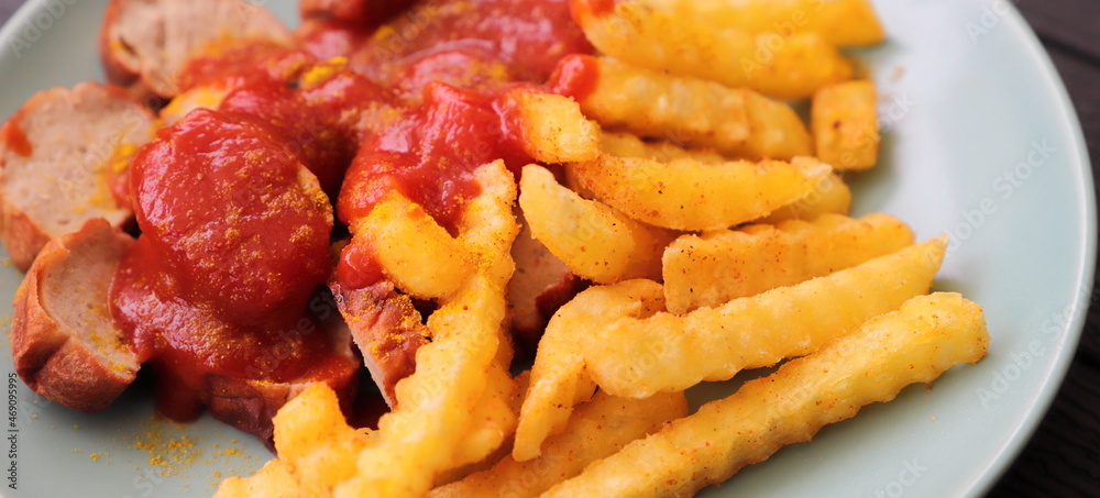 delicious sausage with french fries and curry sauce delicious sausage with french fries and curry sauce
