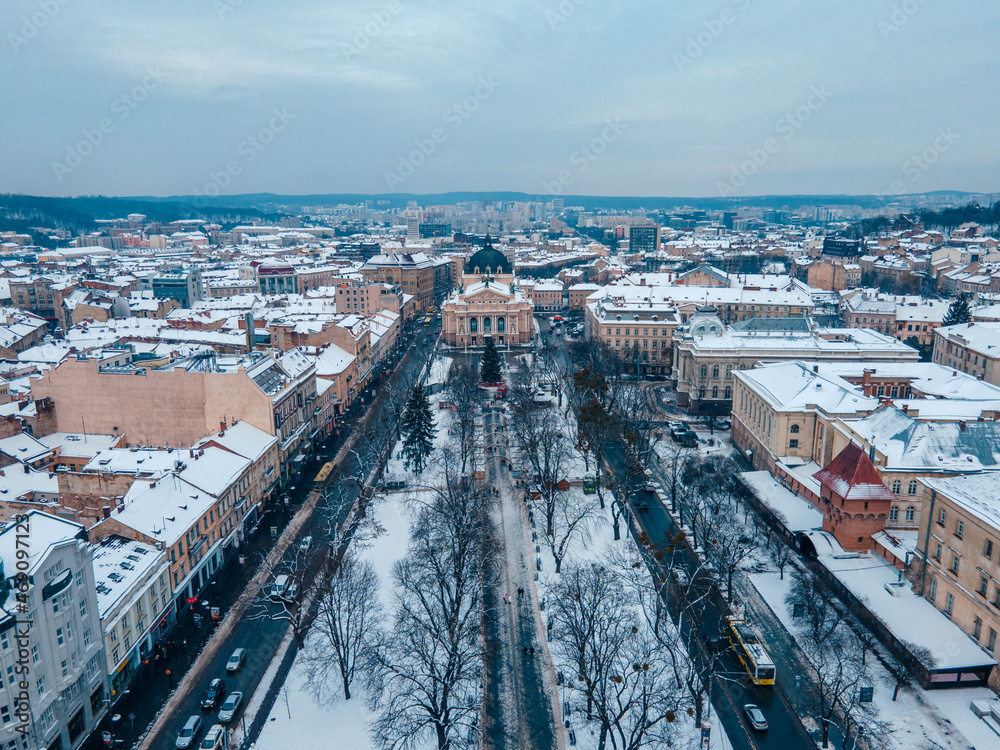 aerial view of snowed lviv center opera building