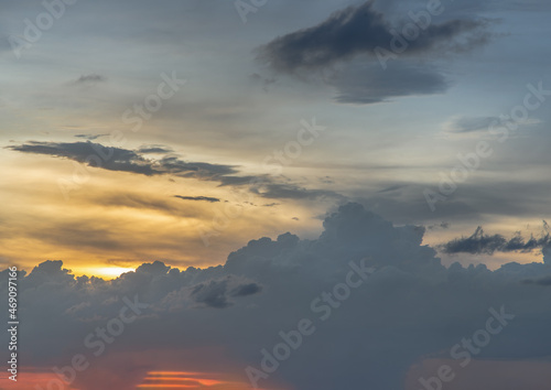 The sun shines through the clouds in the sky.  The shape of the clouds evokes imagination and creativity. They can be used as wallpapers that look amazing. Copy space  No focus  specifically.