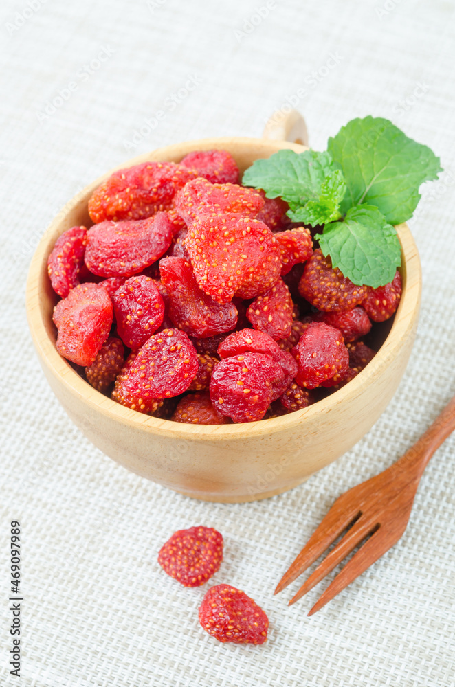 Dried Strawberries in wooden bowl. Dried Strawberries in wooden bowl.