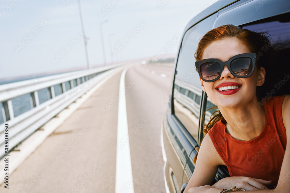 woman looking out of car window wearing sunglasses travel lifestyle woman looking out of car window wearing sunglasses travel lifestyle
