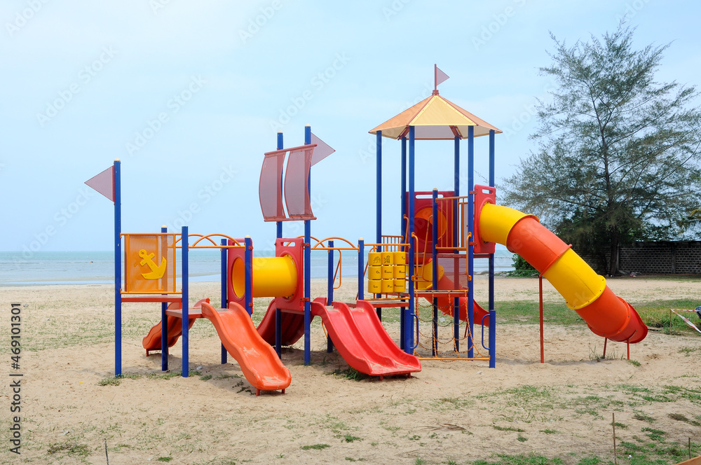 MALACCA, MALAYSIA -MAY 02, 2016: Children's outdoor playground in the public park. It was designed with a few different themes and colors to give a different experience to the kids. MALACCA, MALAYSIA -MAY 02, 2016: Children's outdoor playground in the public park. It was designed with a few different themes and colors to give a different experience to the kids.