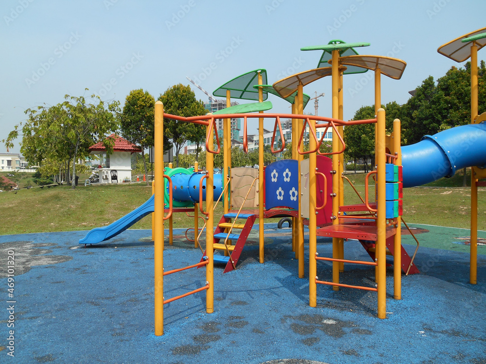 MALACCA, MALAYSIA -MAY 02, 2016: Children's outdoor playground in the public park. It was designed with a few different themes and colors to give a different experience to the kids. MALACCA, MALAYSIA -MAY 02, 2016: Children's outdoor playground in the public park. It was designed with a few different themes and colors to give a different experience to the kids.