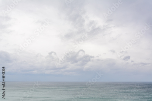 seascape with cloudy sky with nothing else, view from oman sea in chabahar, baluchistan province, iran