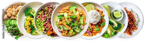 Banner of vegan lunch bowls isolated on white background. Healthy food concept. Vegetarian pasta, curry with rice, salad, tortillas and baked vegetables.