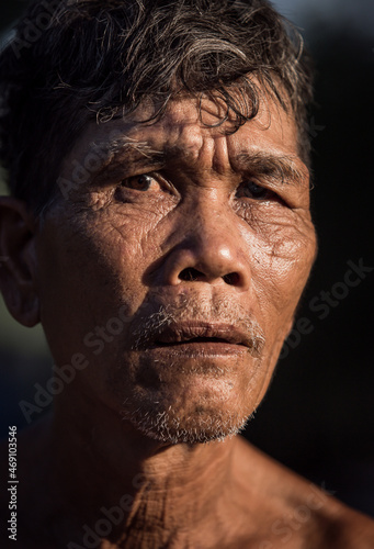 Portrait of older Asian male farmer, in rural Thailand