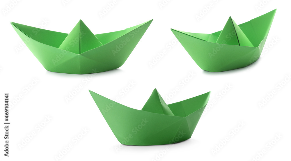 Set with green paper boats on white background