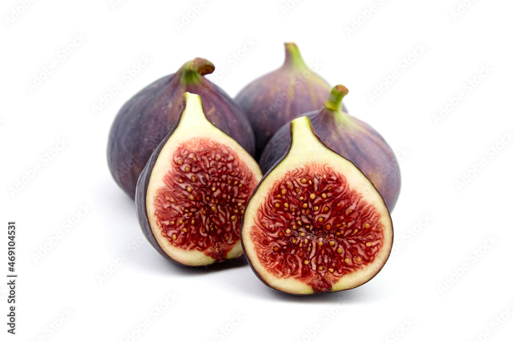 Fig fruit with ripe red halves isolated on white Fig fruit with ripe red halves isolated on white