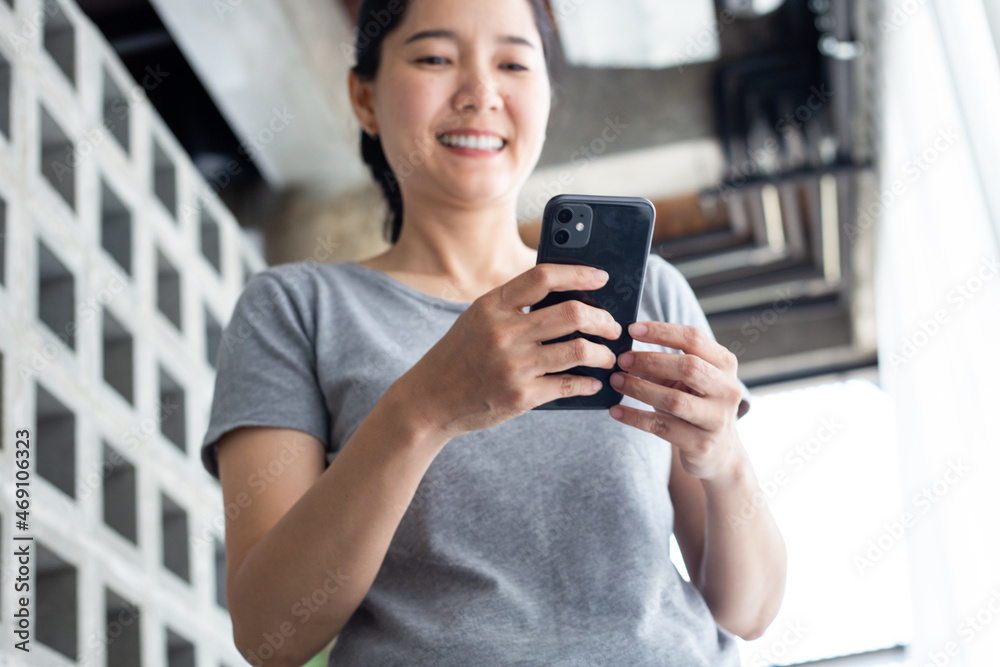 using cell phone hand holding mobile texting message contact us.chatting,search internet information in office.technology device communication connecting using cell phone hand holding mobile texting message contact us.chatting,search internet information in office.technology device communication connecting