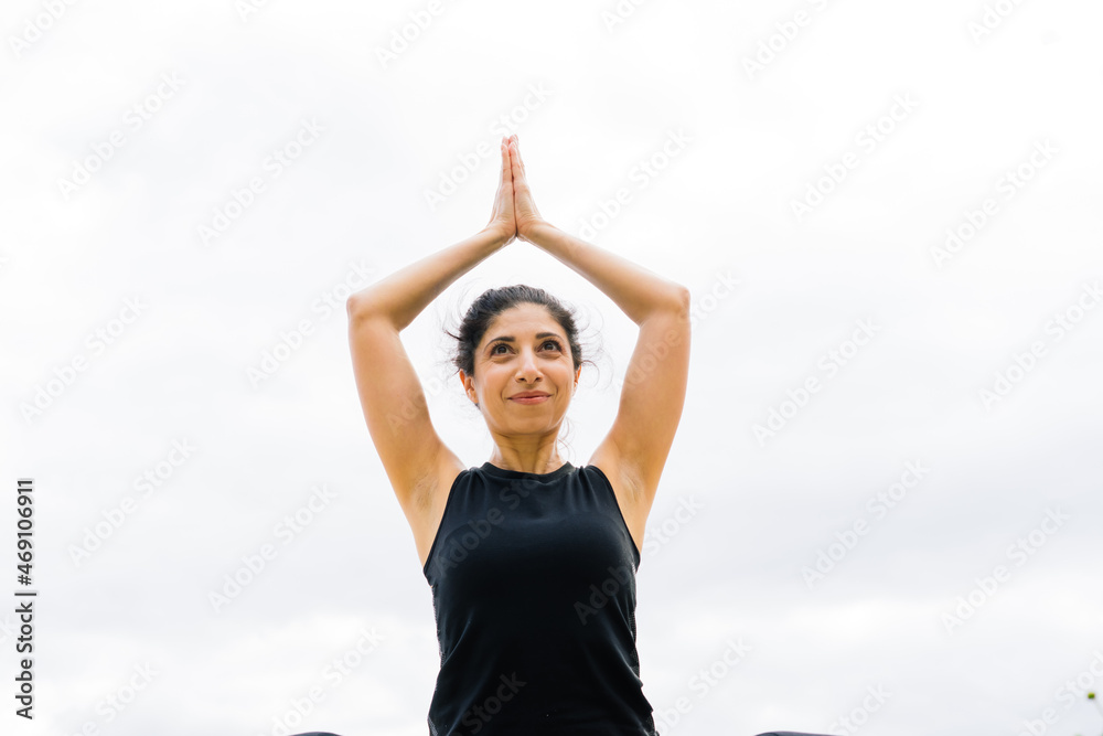 Healthy woman in sportswear practicing yoga outdoor, doing exercise, full length portrait. Healthy woman in sportswear practicing yoga outdoor, doing exercise, full length portrait.
