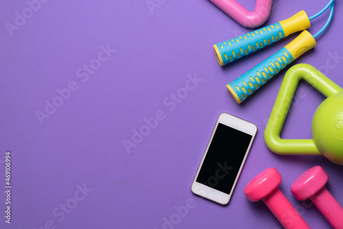 Obraz na płótnie Time for exercising sport equipment with purple yoga mat background