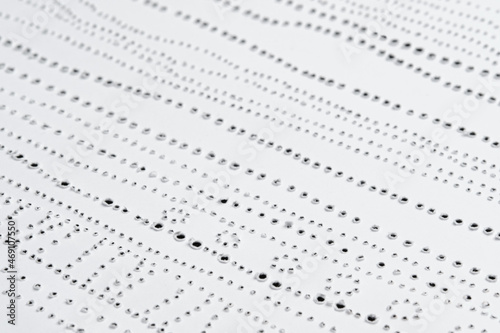 Texture of pierced paper. Simple dot pattern.
