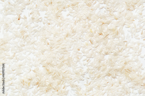 Polished long-grain rice on a white background.