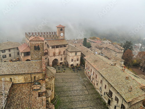 Italian medieval town Castell'Arquato,  province of Piacenza, in Emilia-Romagna. Foggy autumn day. photo