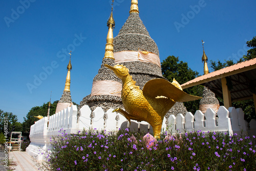 Wat Chedi Hoi or stupa gigantic fossilised oyster shells aged millions of years temple for thai people and foreign travelers travel visit respect praying in Lad Lum Kaew city in Pathum Thani, Thailand photo