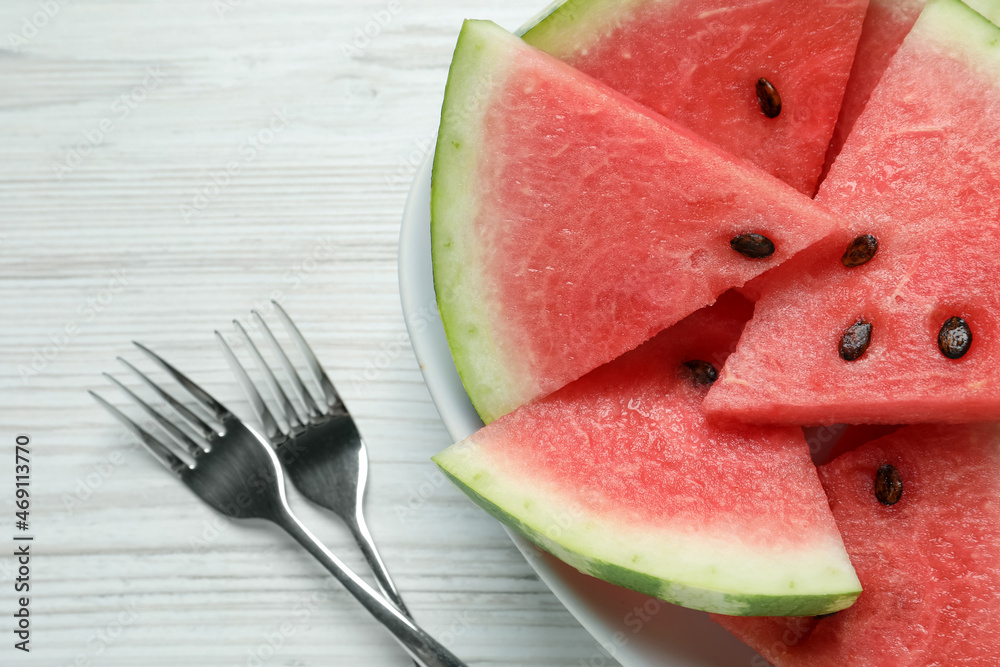 Delicious fresh watermelon slices on white wooden table, flat lay