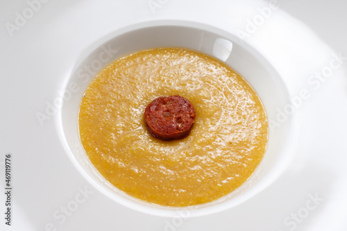 Italien polenta with parmesan cheese and chorizo sausage