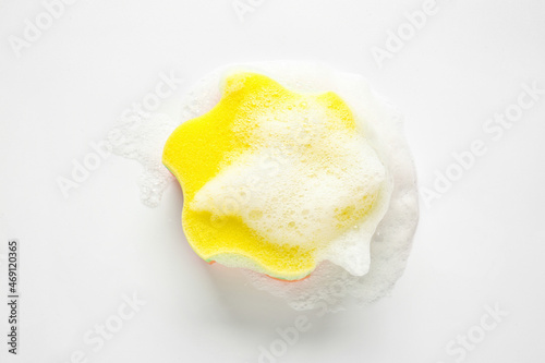 Soapy star shaped bath sponge on white background