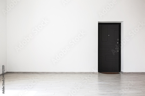 View of empty wall with door in room