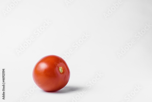 red tomato on a white background. High quality photo