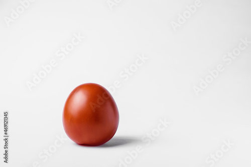 red tomato on a white background. High quality photo