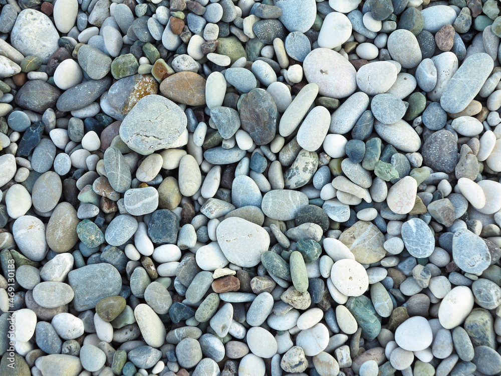 Sea colorful and gray small stones pebbles on a beach