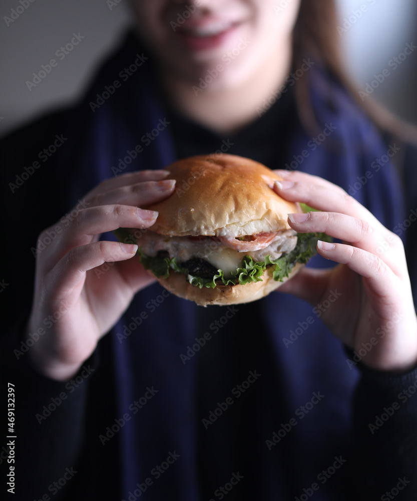 person holding a Burger
