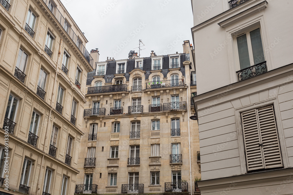 Vintage buildings in urban Paris city center on overcast day