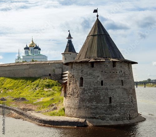 Stone tower and Pskov Kremlin fortress wall at the confluence of two rivers, Russia