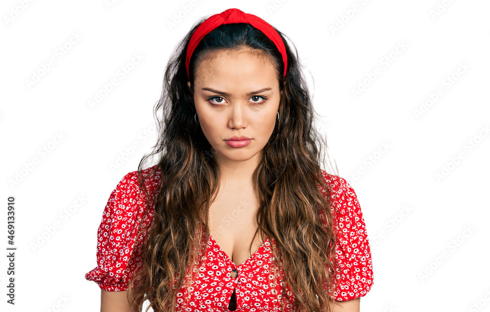 Young hispanic girl wearing casual clothes skeptic and nervous, frowning upset because of problem. negative person. Young hispanic girl wearing casual clothes skeptic and nervous, frowning upset because of problem. negative person.