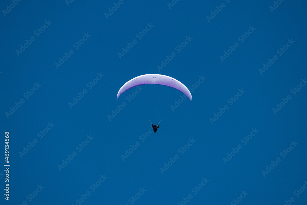 single person paragliding open clear sky blue background Pokhara single person paragliding open clear sky blue background Pokhara