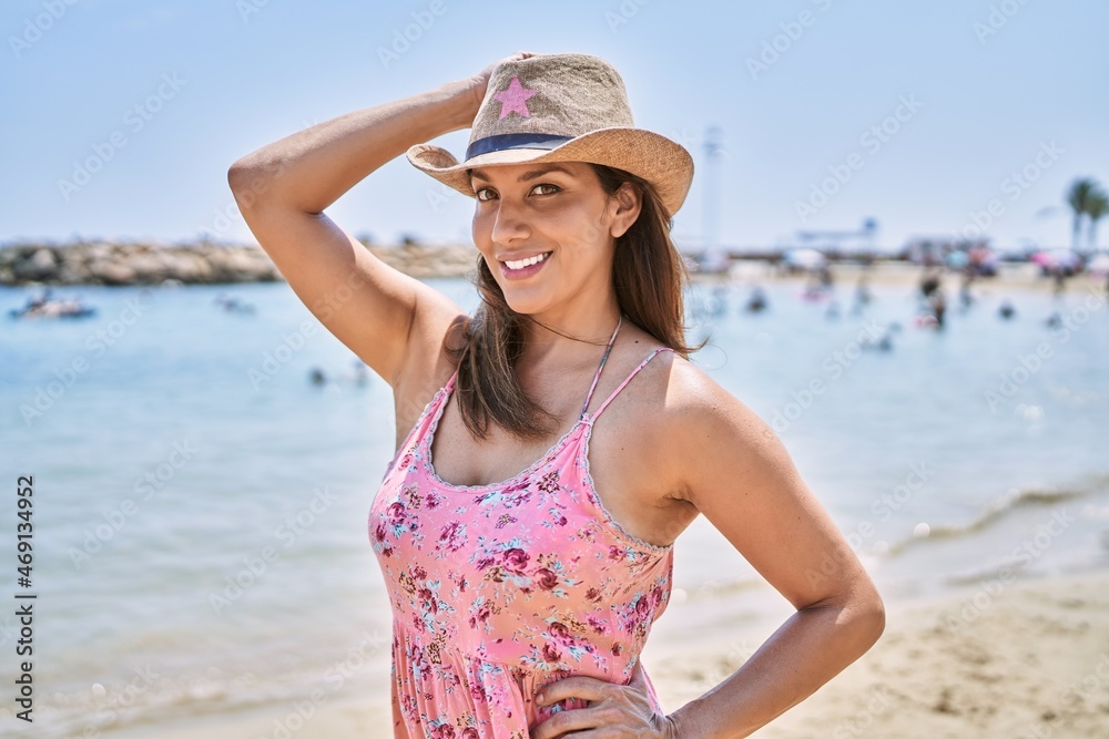 Brunette woman enjoying a summer day at the beach