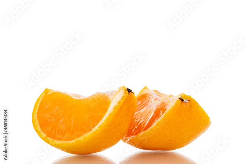 Two slices of sweet tangerine  close-up  isolated on white.