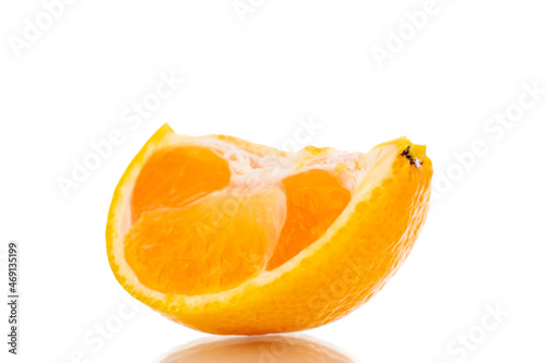 One slice of sweet tangerine, close-up, isolated on white.