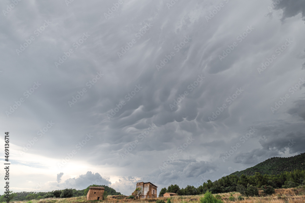 Fototapeta premium Abandoned old house in ruins with stormy sky