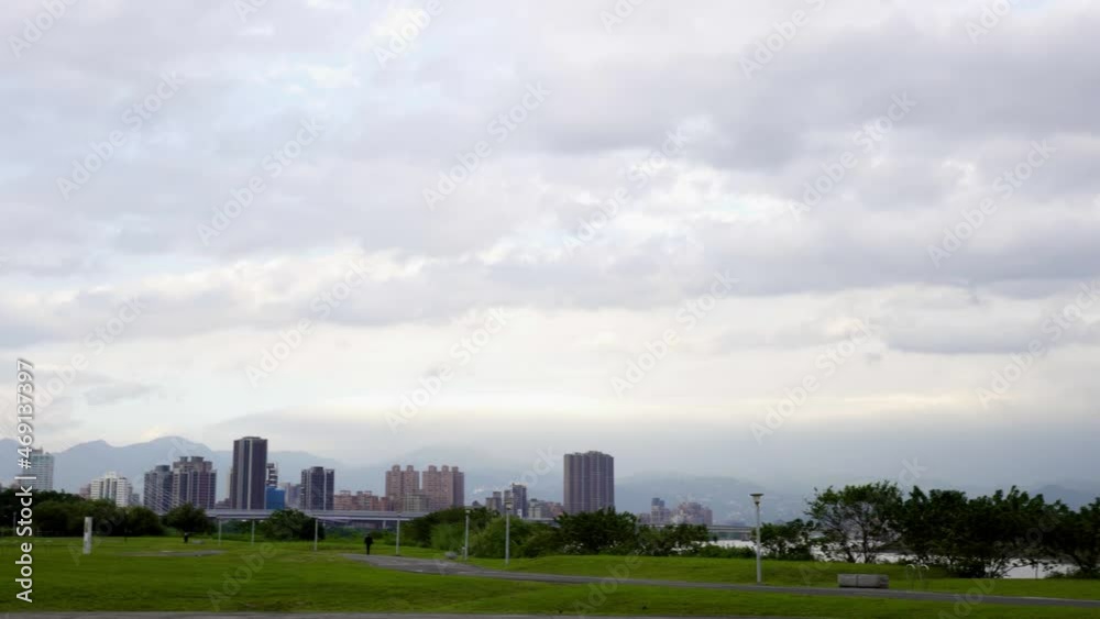 Bicycle trail with grass. The background scenery is buildings, bridges and sky. Bicycle trail with grass. The background scenery is buildings, bridges and sky.