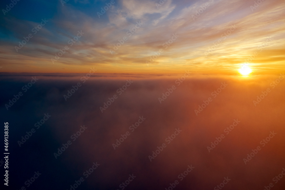 the golden light above the clouds at sunrise