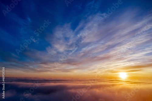 the golden light above the clouds at sunrise © fyb
