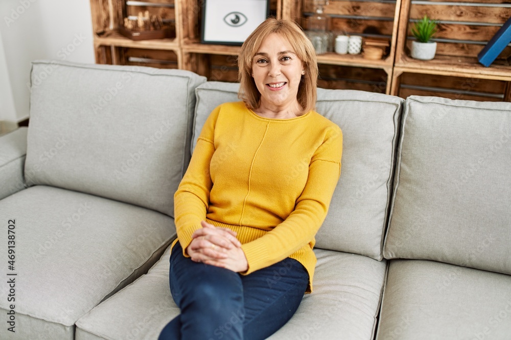 Middle age blonde woman smiling happy at home. Middle age blonde woman smiling happy at home.