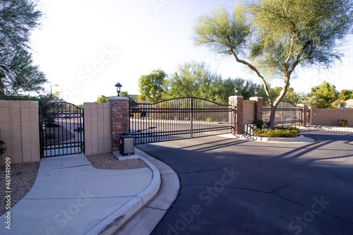 Entrance And Exit Metal Gates At Secure Subdivision
