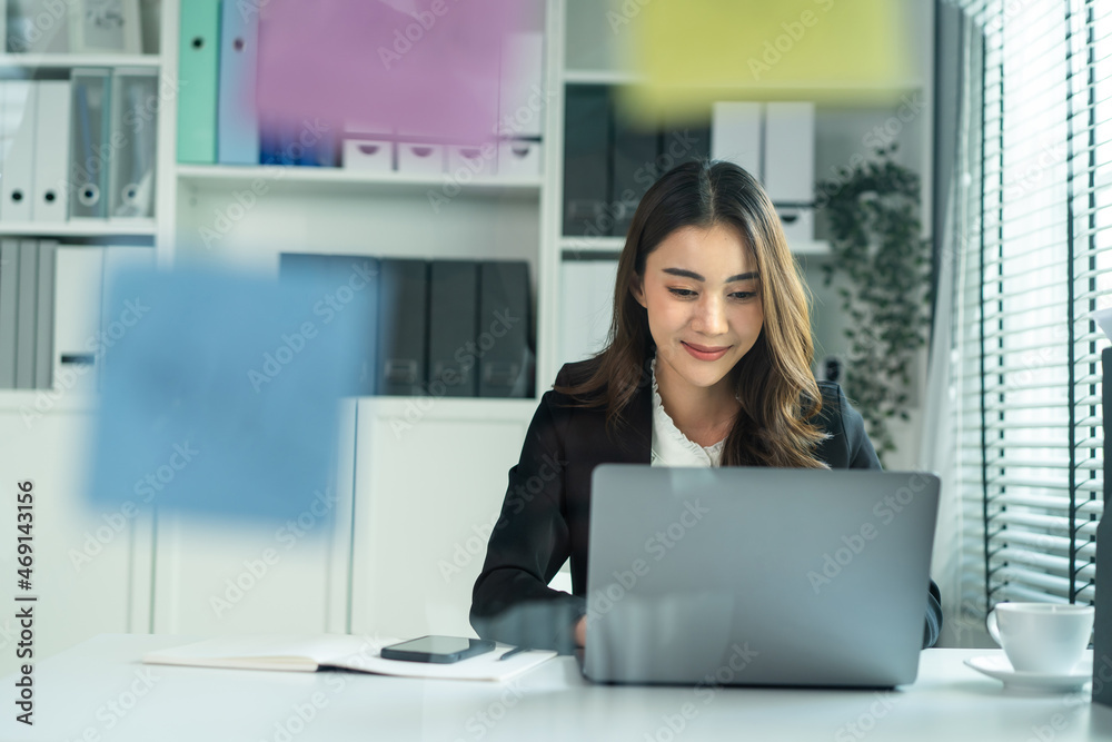 Asian happy beautiful businesswoman in formal suit work in workplace. Asian happy beautiful businesswoman in formal suit work in workplace.