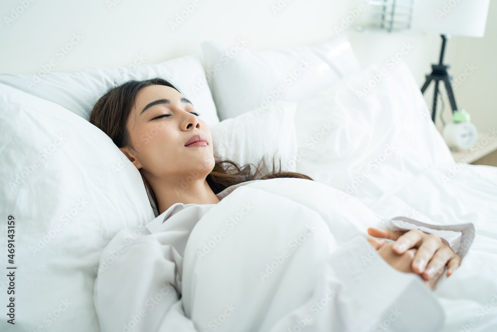 Asian beautiful comfort girl in pajamas get up from sleep in bedroom. Asian beautiful comfort girl in pajamas get up from sleep in bedroom.
